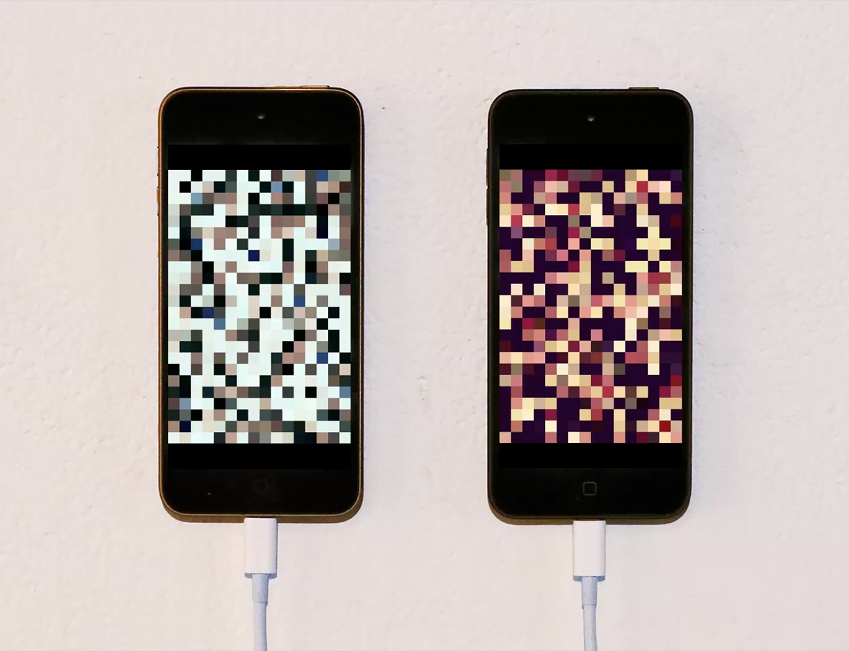 Two iPhones side-by-side, each showing a scramble of pixels